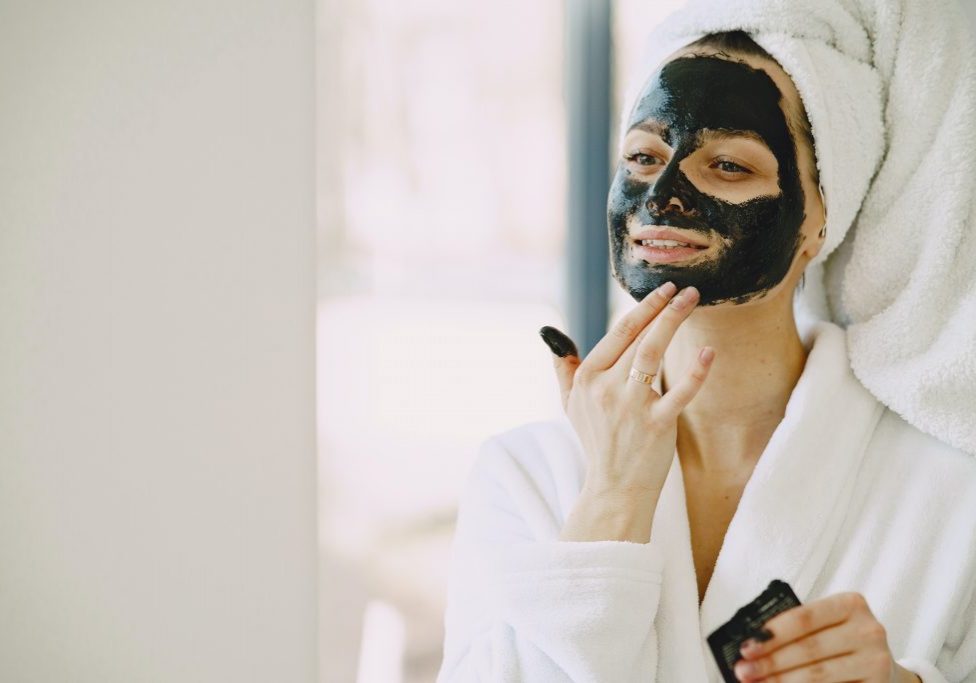 photo-of-woman-applying-clay-mask-on-her-face-4148921